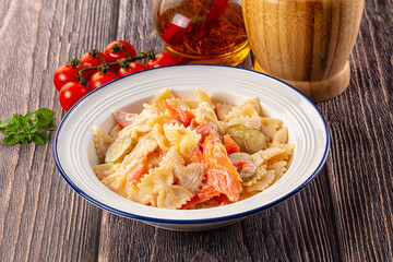 Italian pasta farfalle with salmon