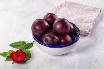 Raw ripe purple plum heap