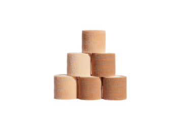 Beige athletic tape rolls stacked.