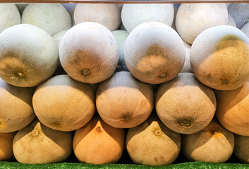 Close-up of Cantaloupes ready for sell.
Freshly harvested cantaloupe melons on display at a market...