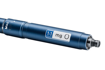 Close-up of a dark-blue medical injection pen.