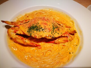 Spaghetti with whole crab in creamy seafood sauce, Japanese-Italian fusion dish