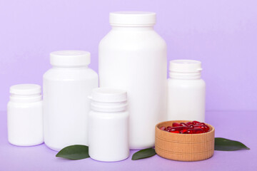 different drugs and health supplement pills with medicine bottle health care and medical top view. Vitamin tablets. Bottle with colored pills on table background. Multivitamins