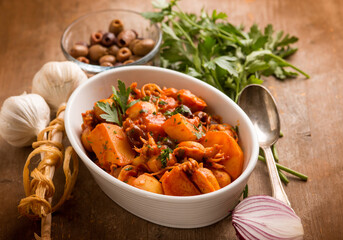 squid with tomato sauce olives and potatoes