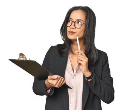 Latina businesswoman holding a report in studio