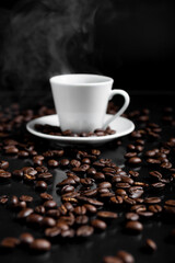 A espresso cup filled with dark coffee surrounded by roasted beans on reflective surface.