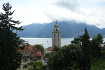 Dramatic Clouds Rolling Over Lugano with Historic Church Tower in Foreground, Ticino, Switzerland