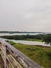 Fototapeta premium Beautiful view of river with clear sky and green surroundings