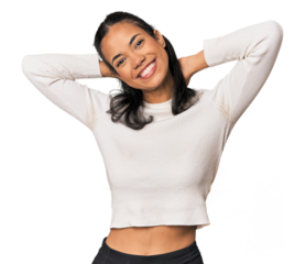 Young Filipina woman stretching arms, relaxed position.