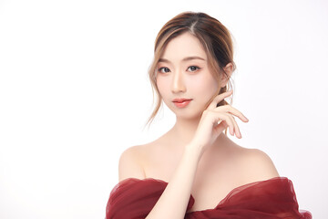 A beautiful young Asian woman with clean, fresh skin against a white background. Skincare, facial...
