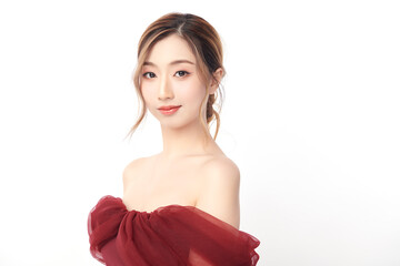 A beautiful young Asian woman with clean, fresh skin against a white background. Skincare, facial...