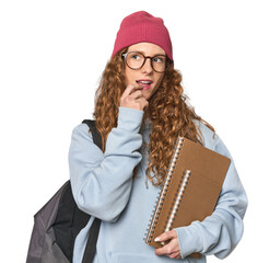 Redhead caucasian young woman student with books relaxed thinking about something looking at a copy...