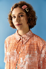 Young woman showcases vibrant summer fashion with curly hair on colorful backdrop
