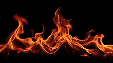 Fototapeta premium Dynamic orange and red flames dance against a stark black backdrop