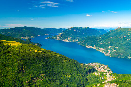 Panorama of Lake Como from above, photographed from Mount Legnoncino, with a view of the mountains and lakeside villages.