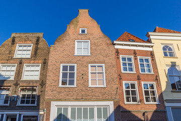 Facades of historic houses on the market square in Grave, Netherlands