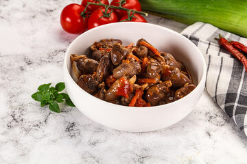 Baked chicken hearts with vegetables