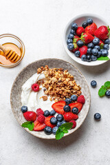 Granola bowl with greek yogurt and fresh berries