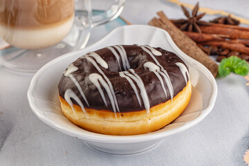 Delicous sweet donut with chocolate glaze