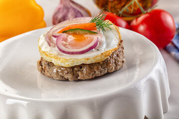 Beefsteak chop with roasted egg