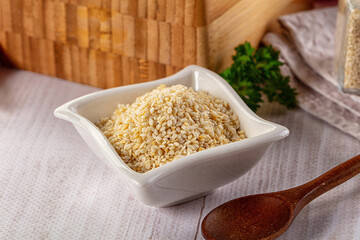 Raw dry sesame seeds heap