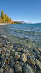 Lakefront View with Clear Water and Mountain Backdrop