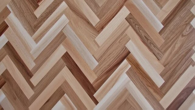 Elegant herringbone pattern parquet flooring texture and design background video loop