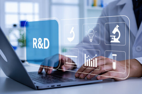A person is engaged in research and development using a laptop, highlighting scientific innovation and technological advancement with a digital interface
