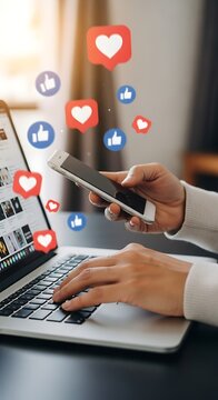 Social media engagement concept laptop phone likes and hearts