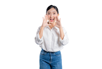 Asian woman in a casual outfit cups her hands around her mouth as if shouting, making an important announcement, or sharing great news with a cheerful expression.
