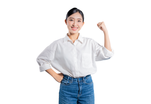 A confident and strong young Asian woman with one hand on her hip makes a fist pump gesture, smiling to show power, success, and empowerment against a png background.