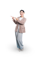 Asian businesswoman in a dynamic pose uses both hands to point to the side, enthusiastically drawing attention to something in the copy space with a bright smile.
