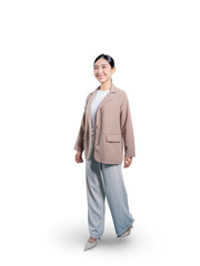 Full-length shot of a confident and happy young Asian businesswoman walking and looking to the side with a cheerful smile, captured in motion against a seamless png background.

