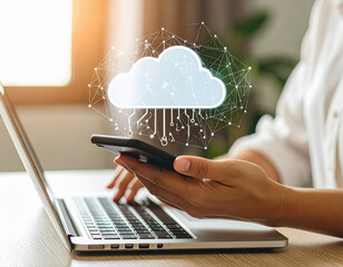 Photography of a person using the phone and labtop with cloud icon on the screen.