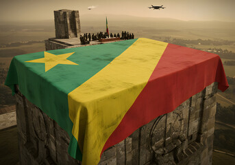 Burkina Faso Flag on a Stone Tower with People, Drones, and Landscape View Patriotism and Freedom.
