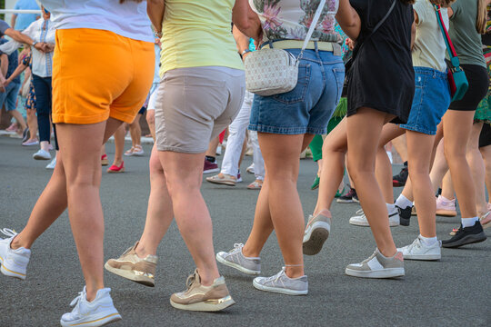 Women dancing in summer on city square during outdoor event, traditional Bulgarian folk dance Horo. Concept of dancing, cultural heritage, embodying the spirit, history, traditions of Bulgarian people