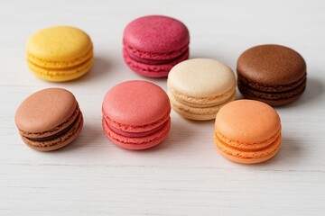 Obraz premium Sweet coconut confections arranged on a rustic white wood surface