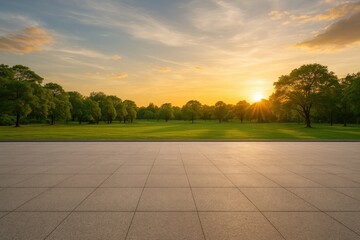 Wide-angle view of an open runway surface adjacent to a lush park during sunset