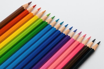 A collection of colorful pencils arranged on a white surface, perfect for creating artwork in school art classes. Children require all these supplies.