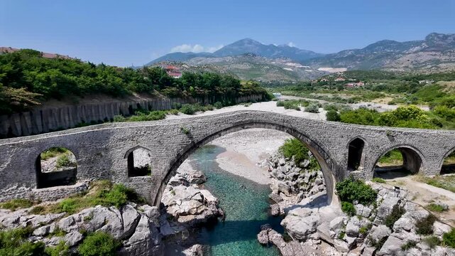 Cinematic Pan of Mesi Bridge in Albania &ndash; Historic Stone Arch Over River
