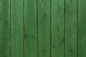 Fototapeta premium Close-up of weathered green wooden boards with aged paint