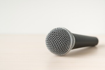 Light background microphone highlighting music theme