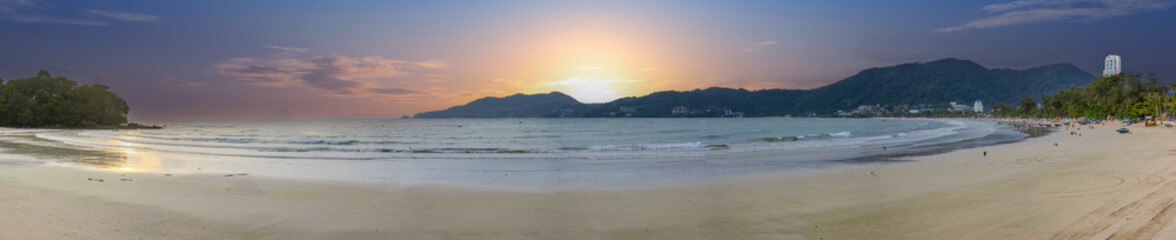 Fototapeta premium Beautiful and colourful Panorama of Patong Beach at Sunset on the romantic island of Phuket Thailand