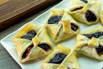 Envelopes from dough with jam. Puff pastry. Dessert