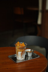 Closeup of Iced Caramel Macchiato at the coffee shop, Caramel Macchiato is a classic macchiato beverage. It consists of vanilla syrup, espresso, steamed milk, foam, and caramel drizzle