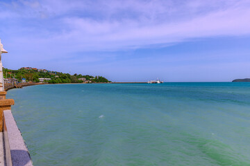 Turquoise blue waters and Lush green islands of the coast of Cape Panwa located on the eastern side of Phuket island in Thailand
