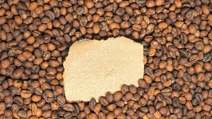 Brown cardboard torn texture paper on dry brown coffee beans frame
