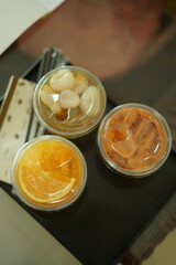 Closeup of Iced Caramel Macchiato at the coffee shop, Caramel Macchiato is a classic macchiato beverage. It consists of vanilla syrup, espresso, steamed milk, foam, and caramel drizzle