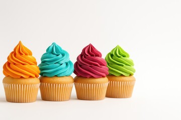 Delicious cupcakes topped with vibrant frosting on a plain white backdrop, close-up shot