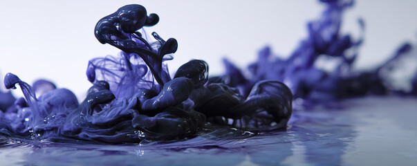 Colorful purple ink swirls in water creating intricate patterns and textures over a light background